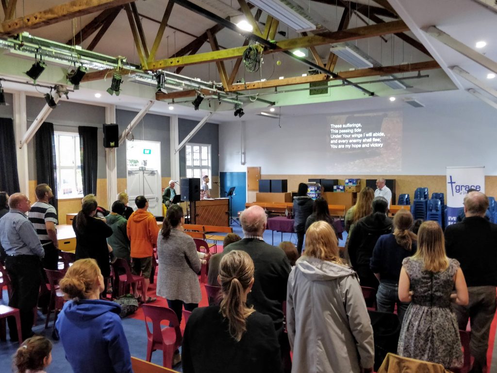 Sunday Service - congregation gather and sing