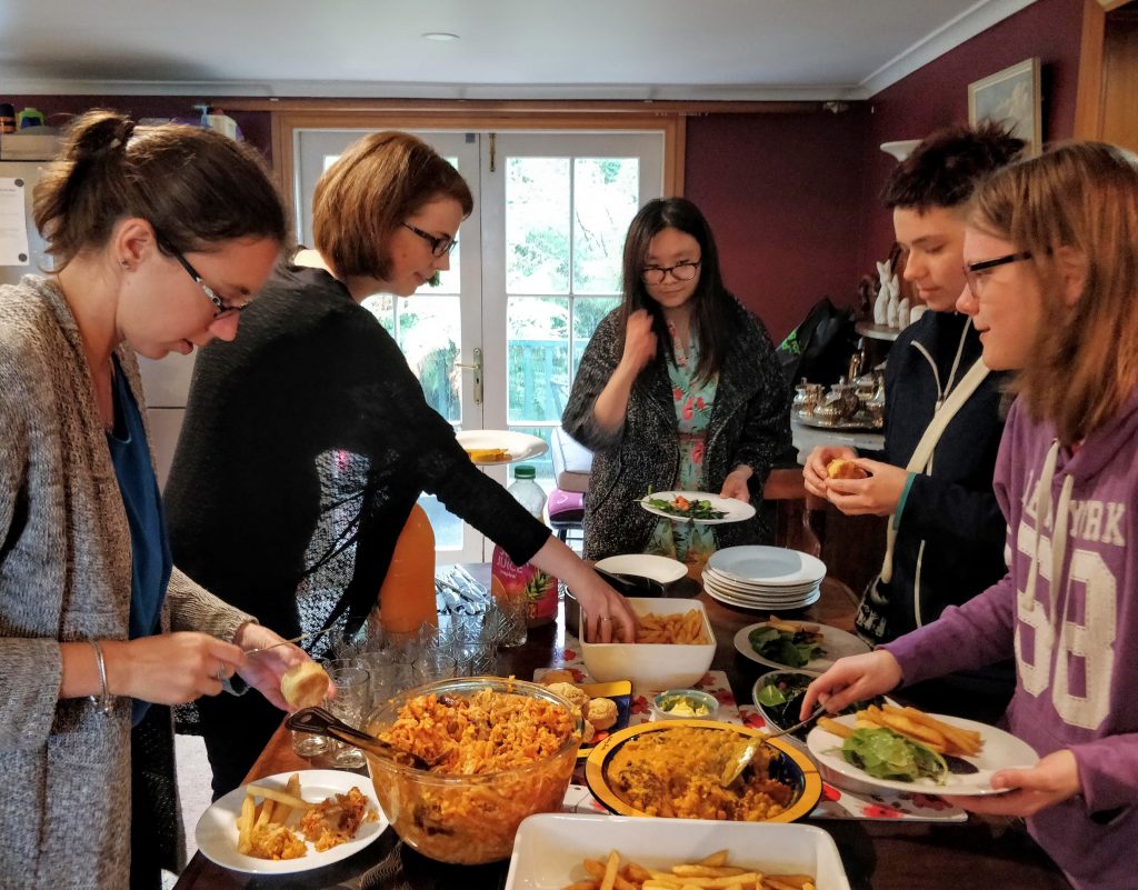 Sunday lunch - members and guests gathered round buffet table