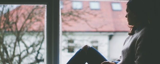 Lady stares out of window